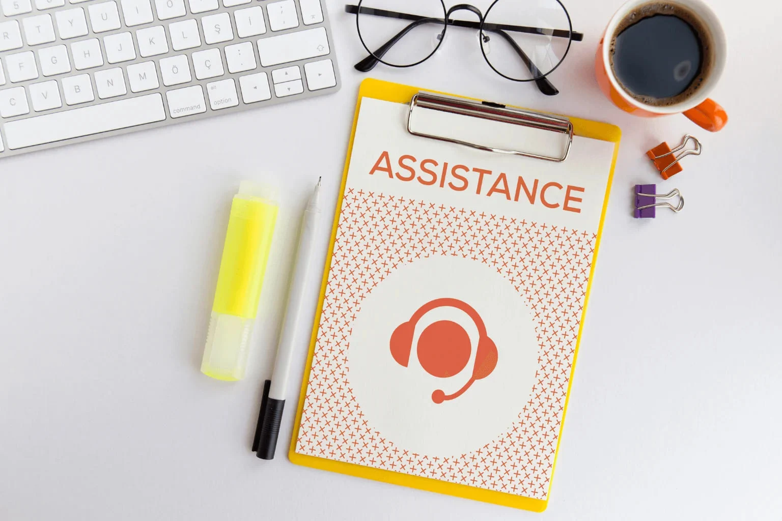 Paper labeled assistance on a table, representing housing support resources