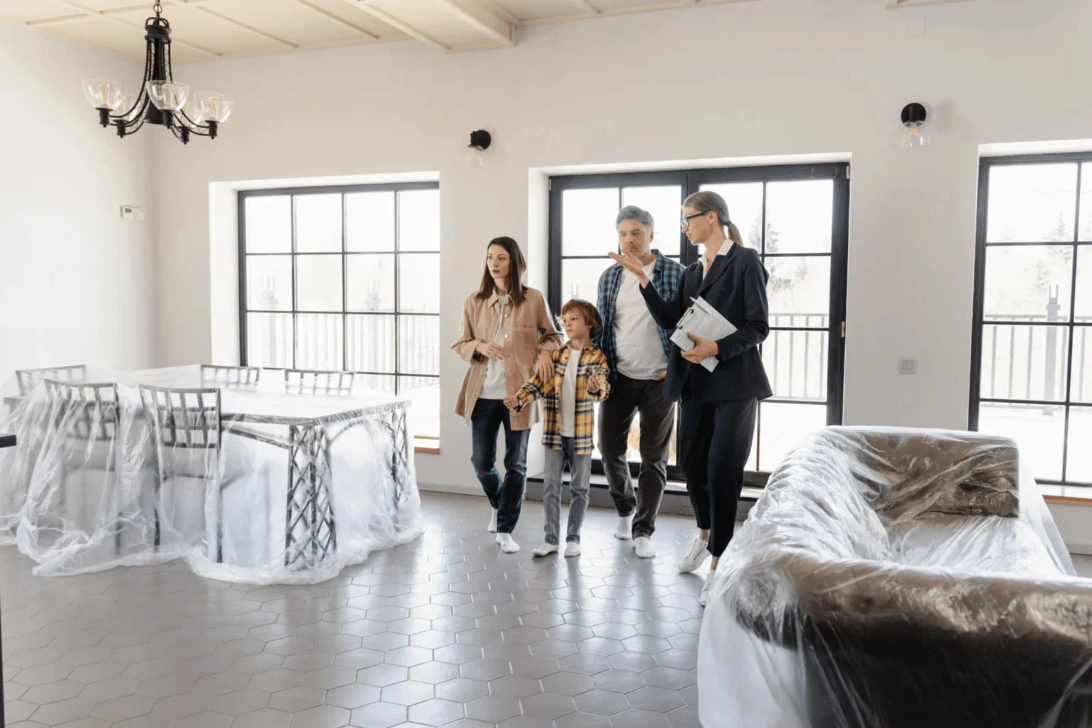 Best Luxury Homes in Clayton real estate agent showing home to a family