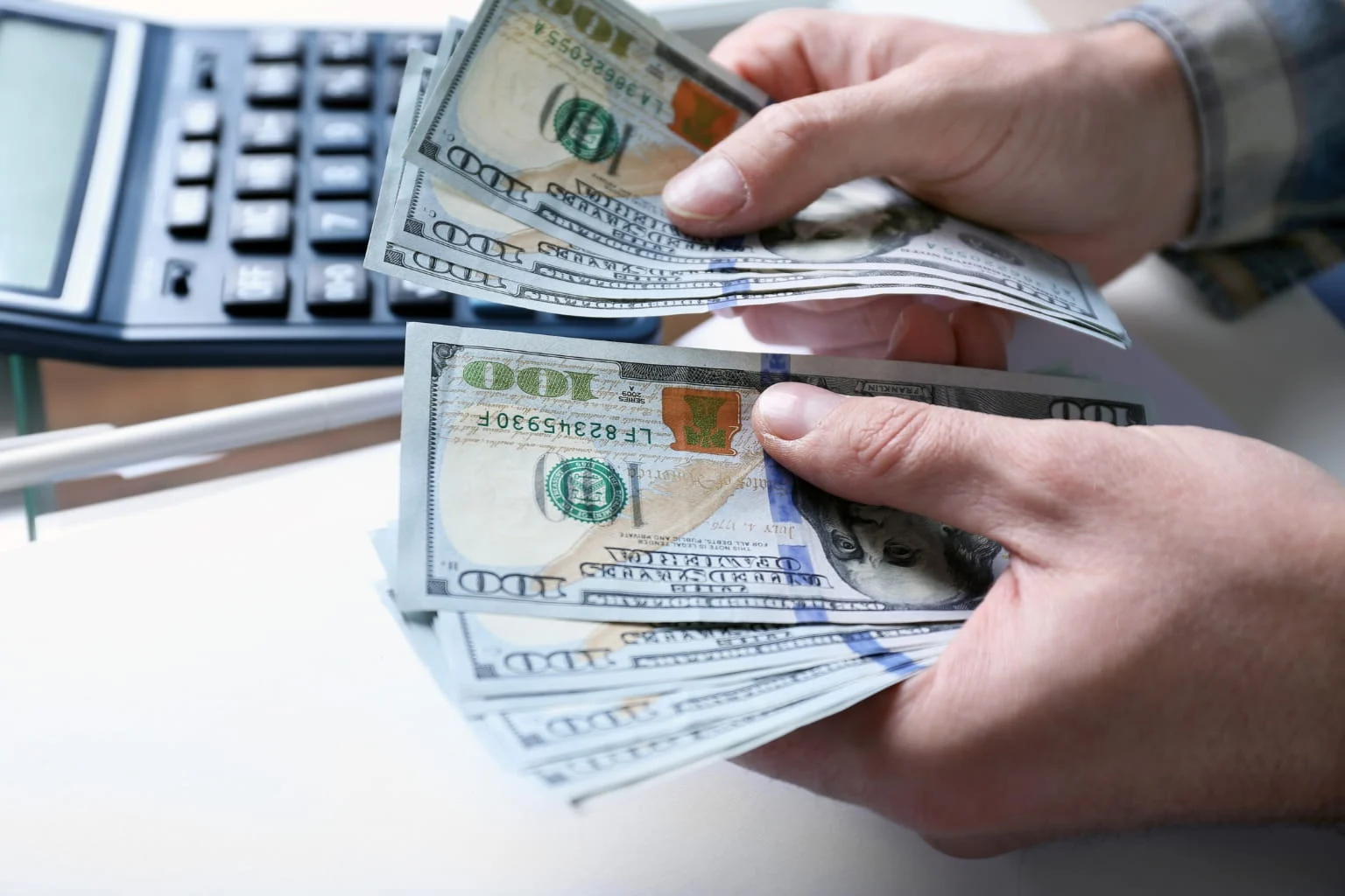 Close-up of hands counting money